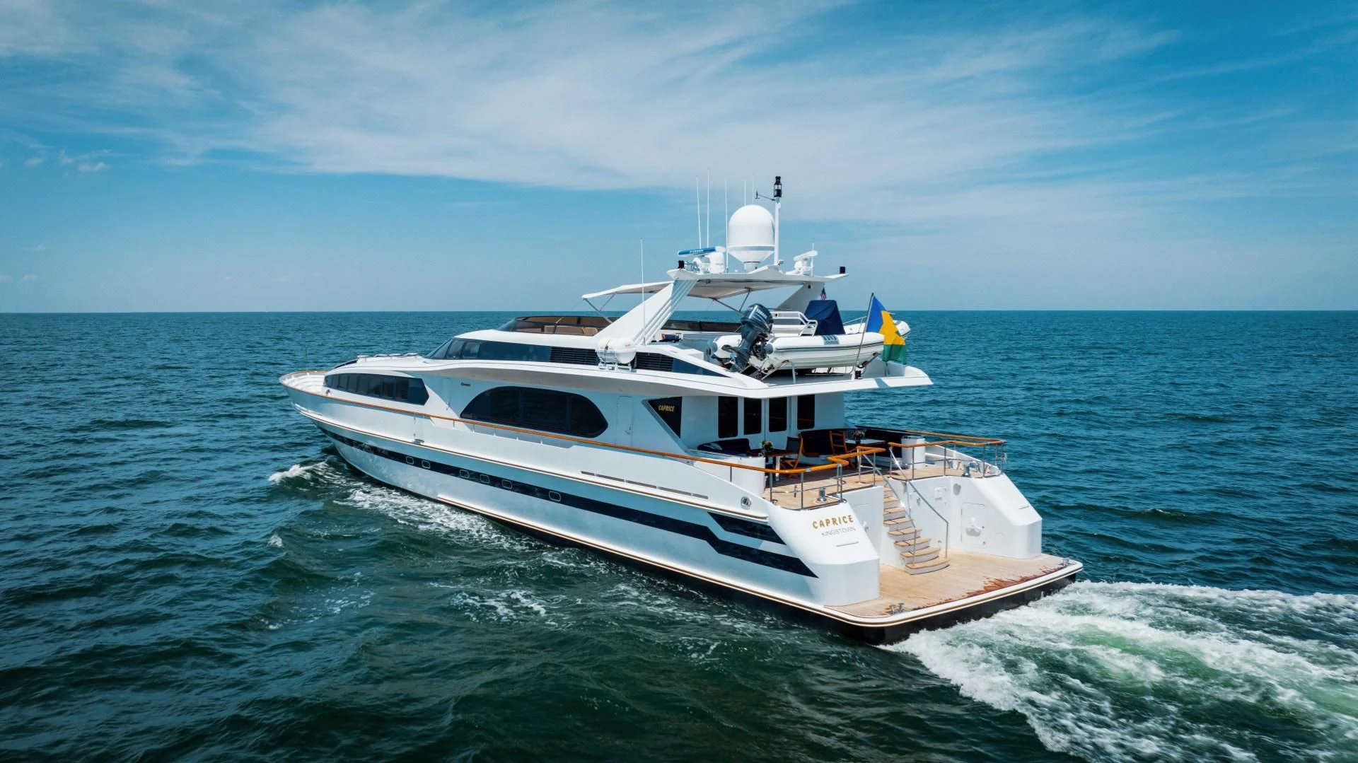 a white yacht in the ocean aboard DREAM RIDER Yacht for Sale