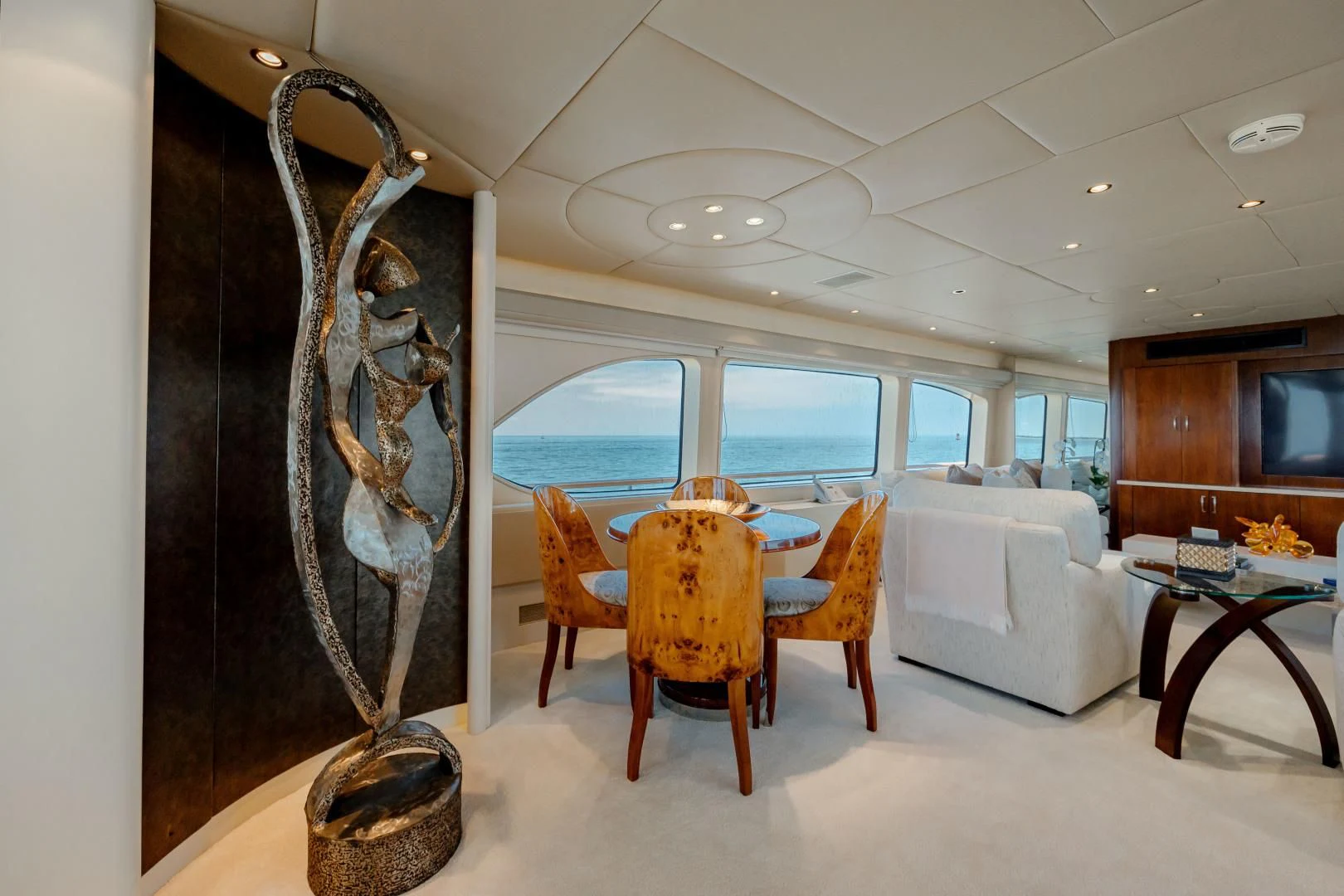 a room with a table and chairs aboard DREAM RIDER Yacht for Sale