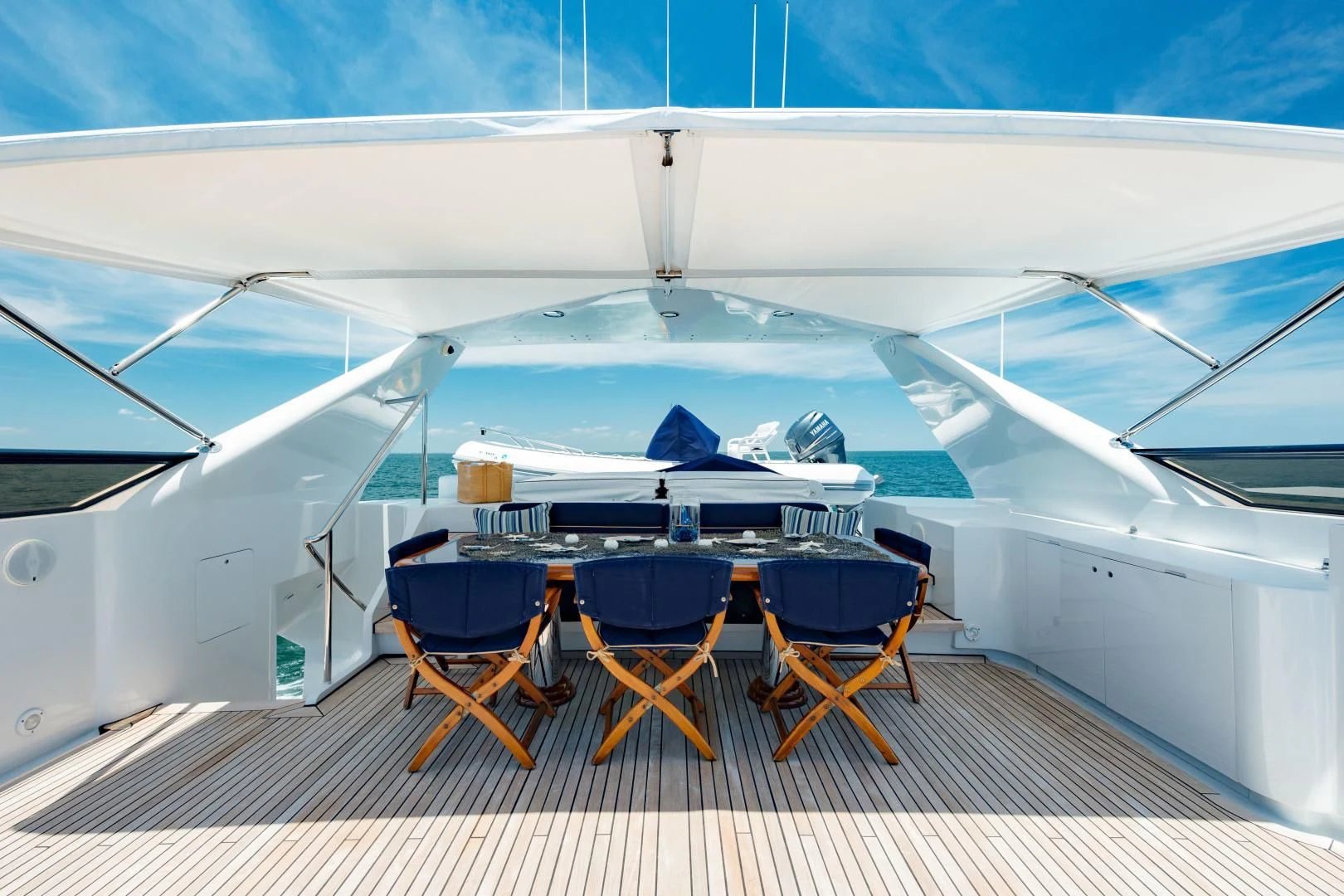 a group of chairs around a table aboard DREAM RIDER Yacht for Sale