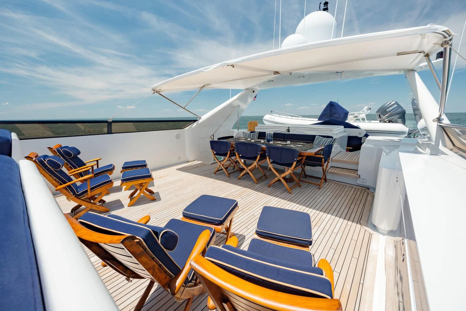 a boat with many seats and tables aboard DREAM RIDER Yacht for Sale
