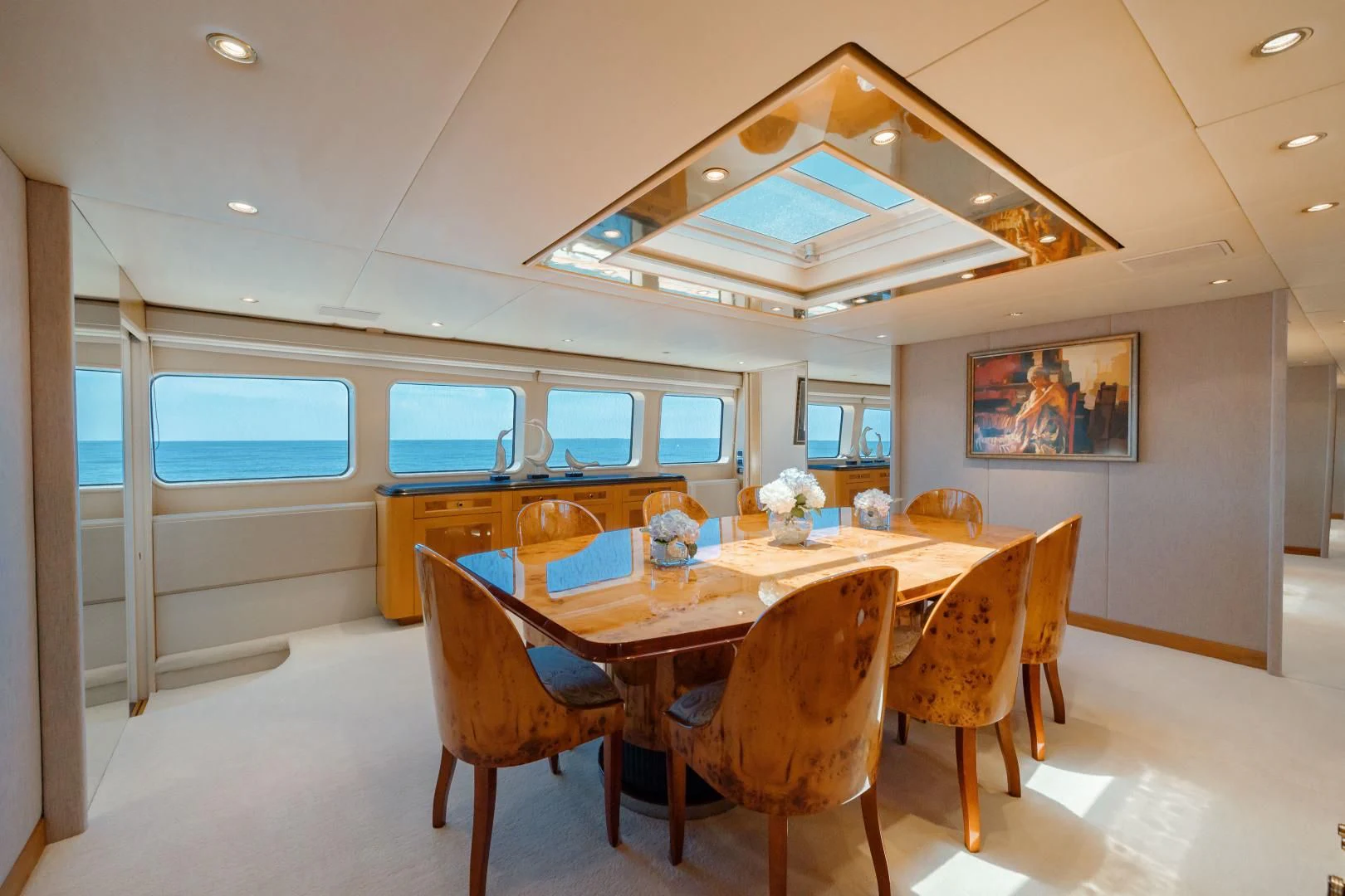 a large kitchen with a dining table aboard DREAM RIDER Yacht for Sale
