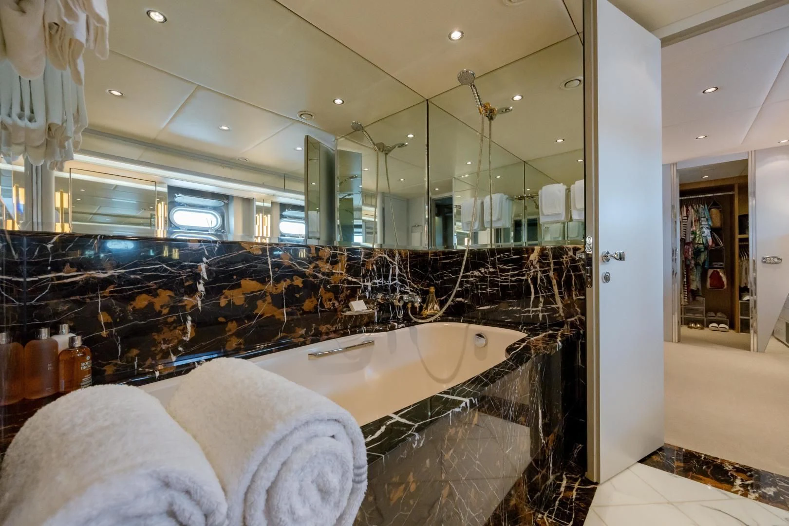 a large bathroom with a large glass shower aboard DREAM RIDER Yacht for Sale