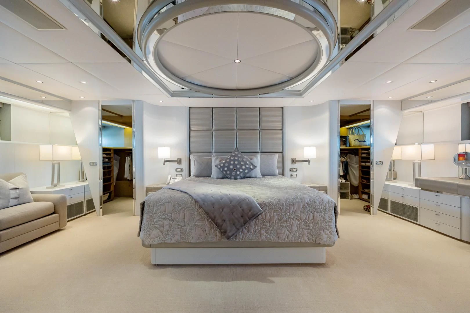 a large room with a bed and a large mirror aboard DREAM RIDER Yacht for Sale