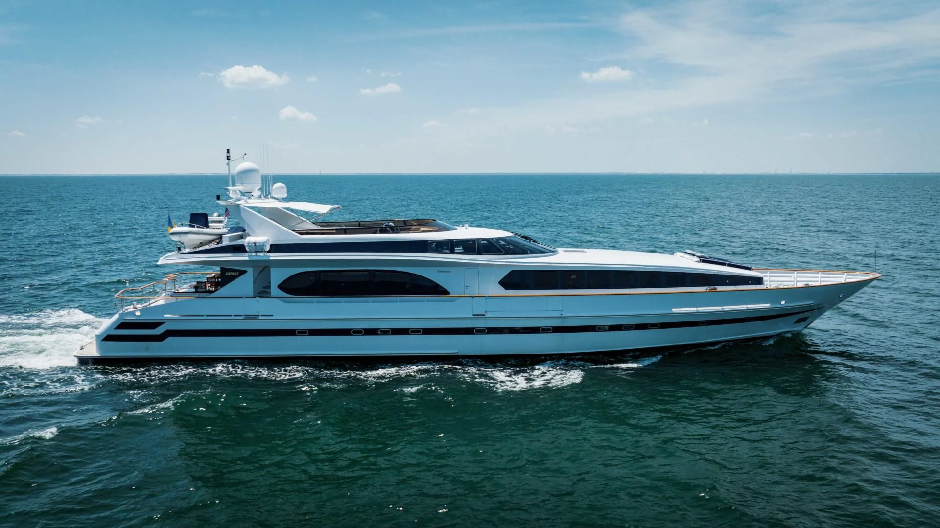 a white yacht in the water aboard DREAM RIDER Yacht for Sale