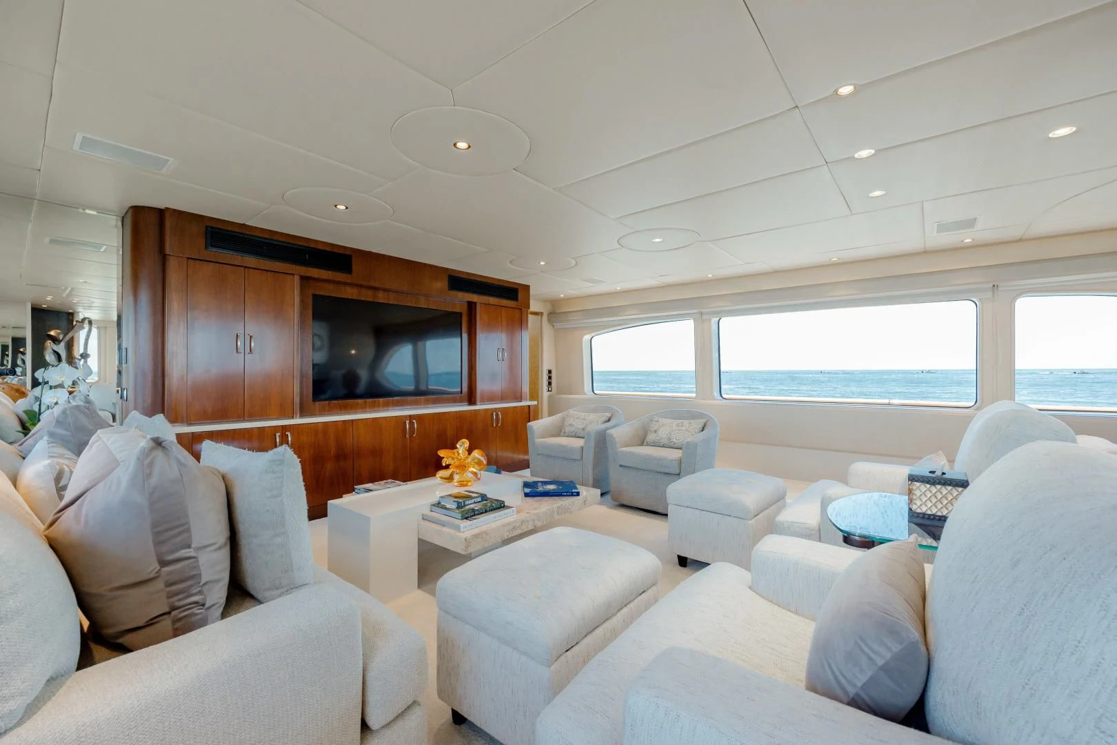 a living room with a large window aboard DREAM RIDER Yacht for Sale