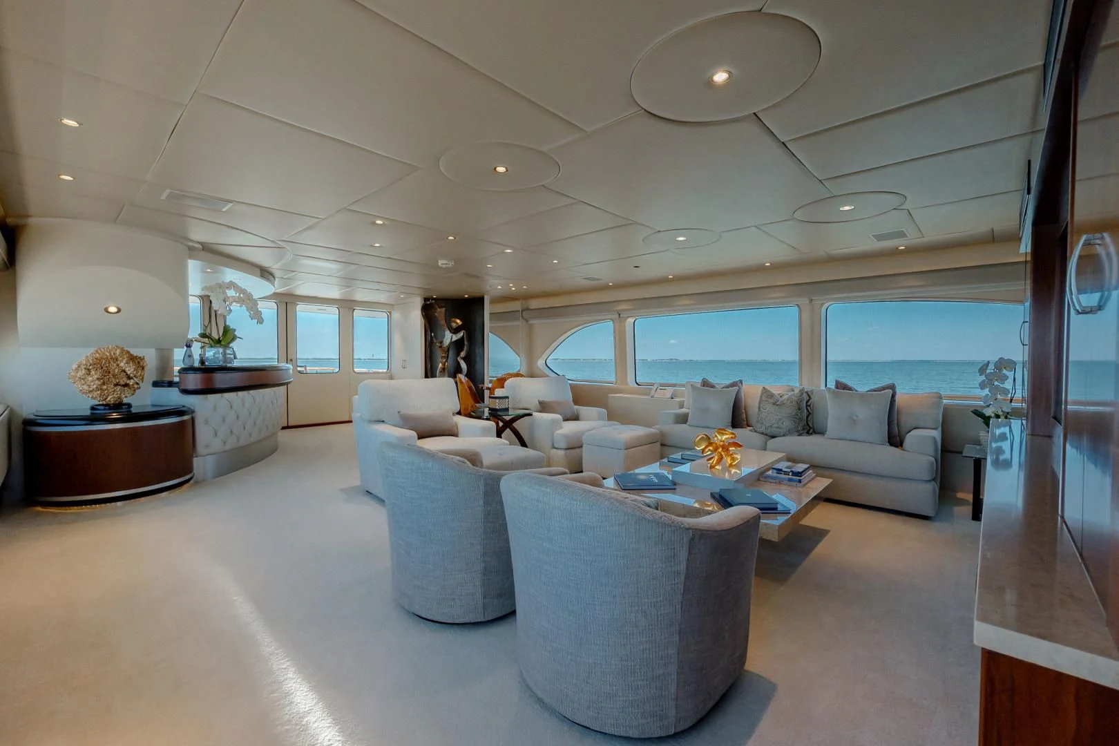 a living room with a large window aboard DREAM RIDER Yacht for Sale