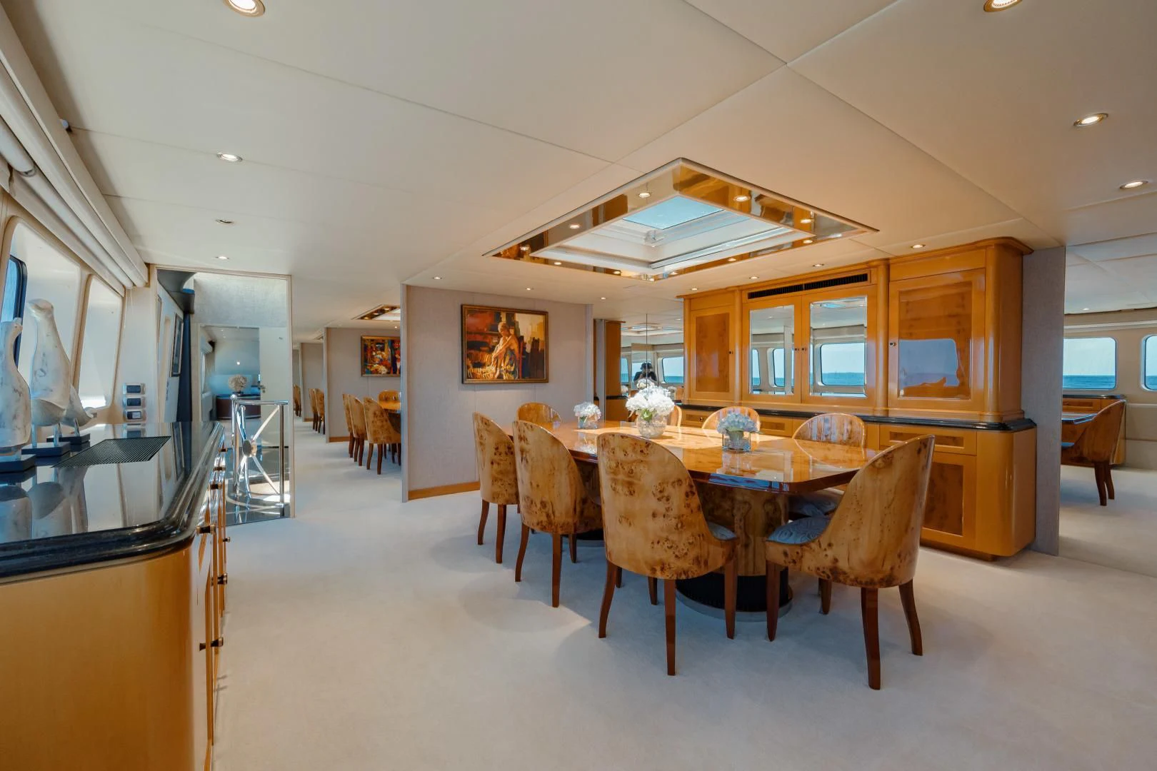 a dining room with a table aboard DREAM RIDER Yacht for Sale