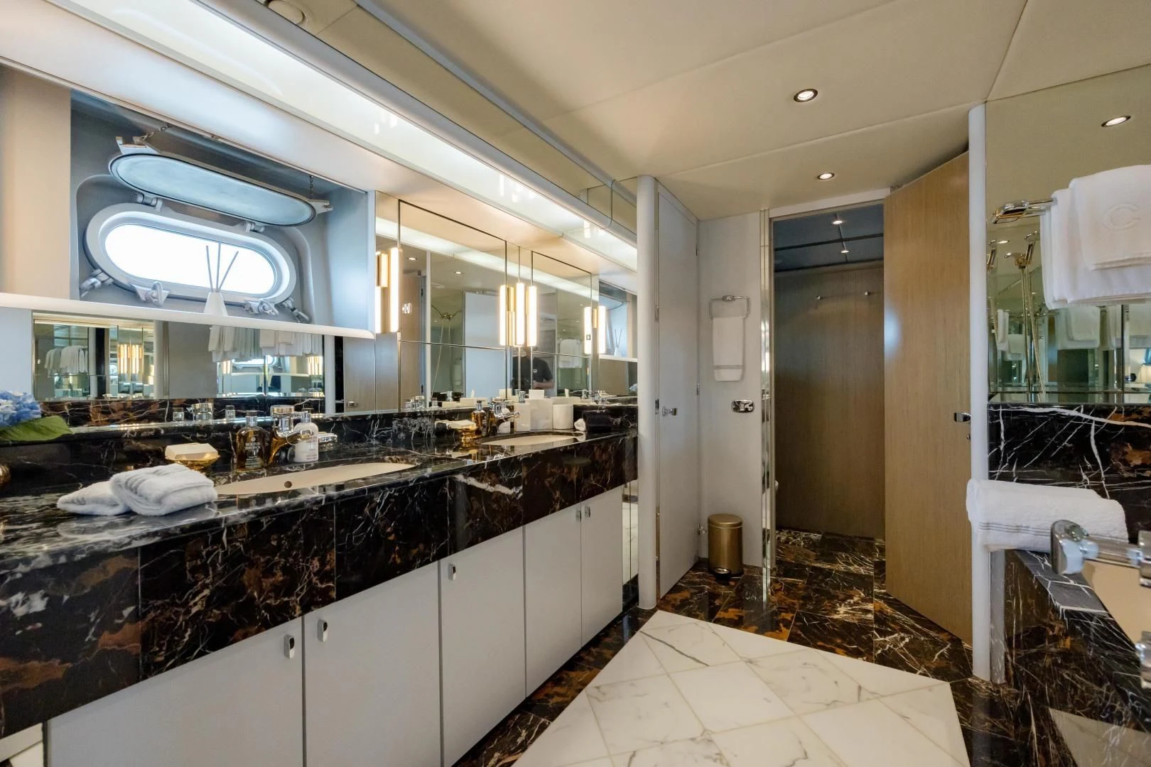a bathroom with a large mirror aboard DREAM RIDER Yacht for Sale