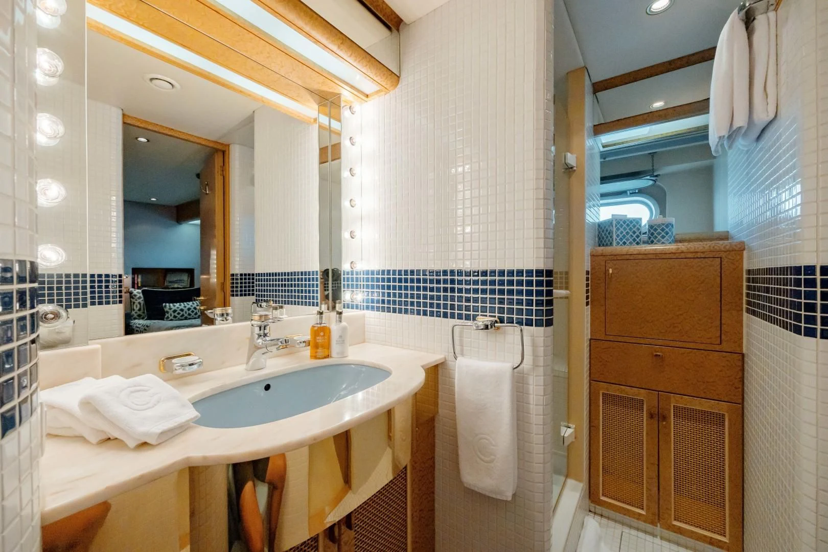a bathroom with a sink and a mirror aboard DREAM RIDER Yacht for Sale