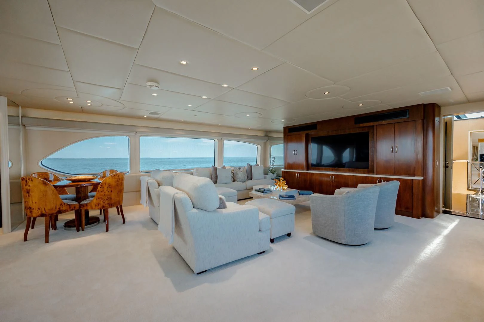 a living room with a large wood cabinet aboard DREAM RIDER Yacht for Sale