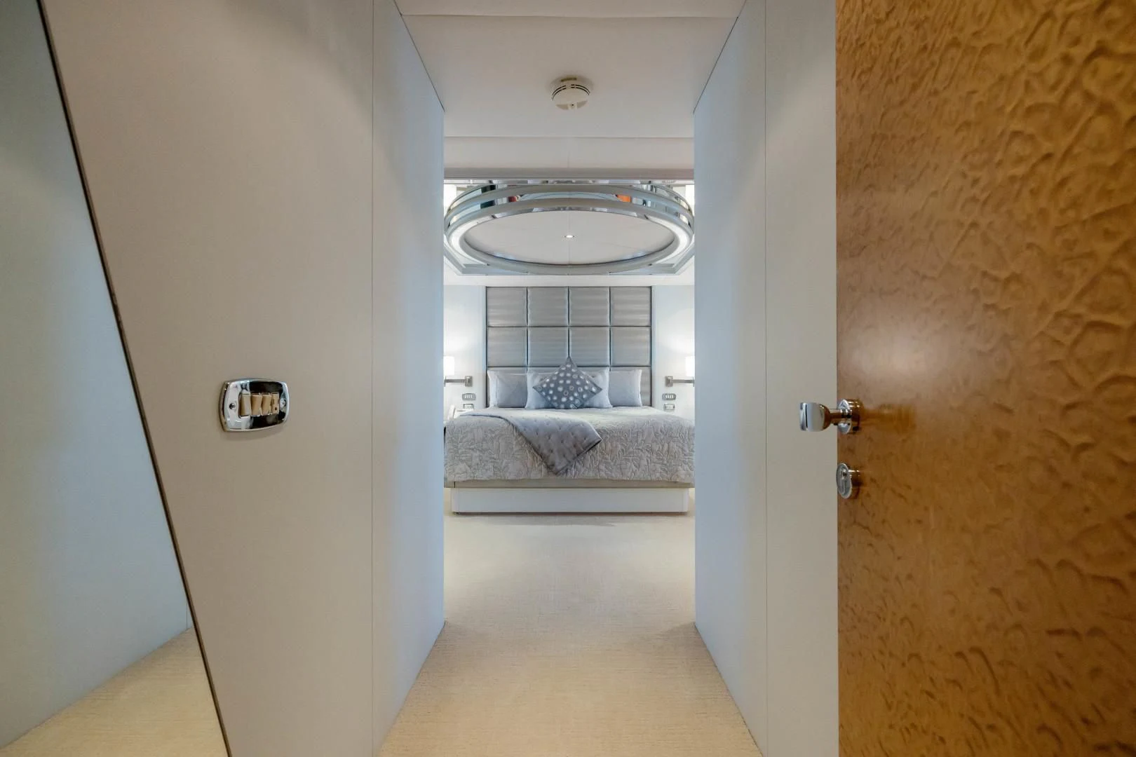 a white living room with a white couch and a white wall aboard DREAM RIDER Yacht for Sale