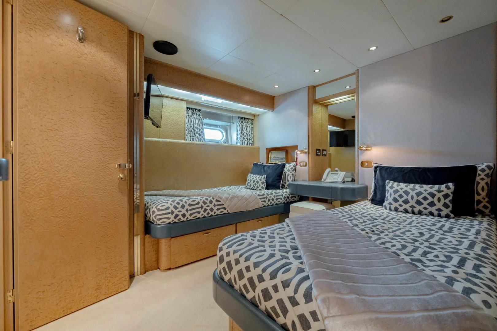 a bedroom with two beds aboard DREAM RIDER Yacht for Sale