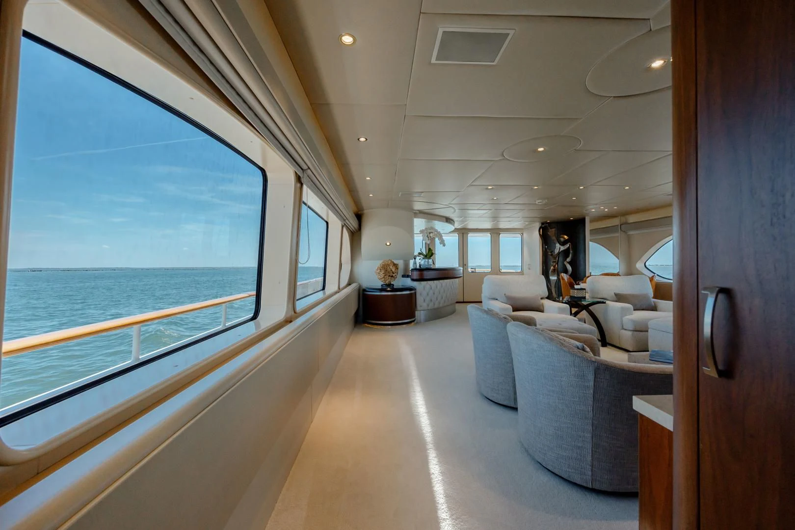 a living room with a large window aboard DREAM RIDER Yacht for Sale