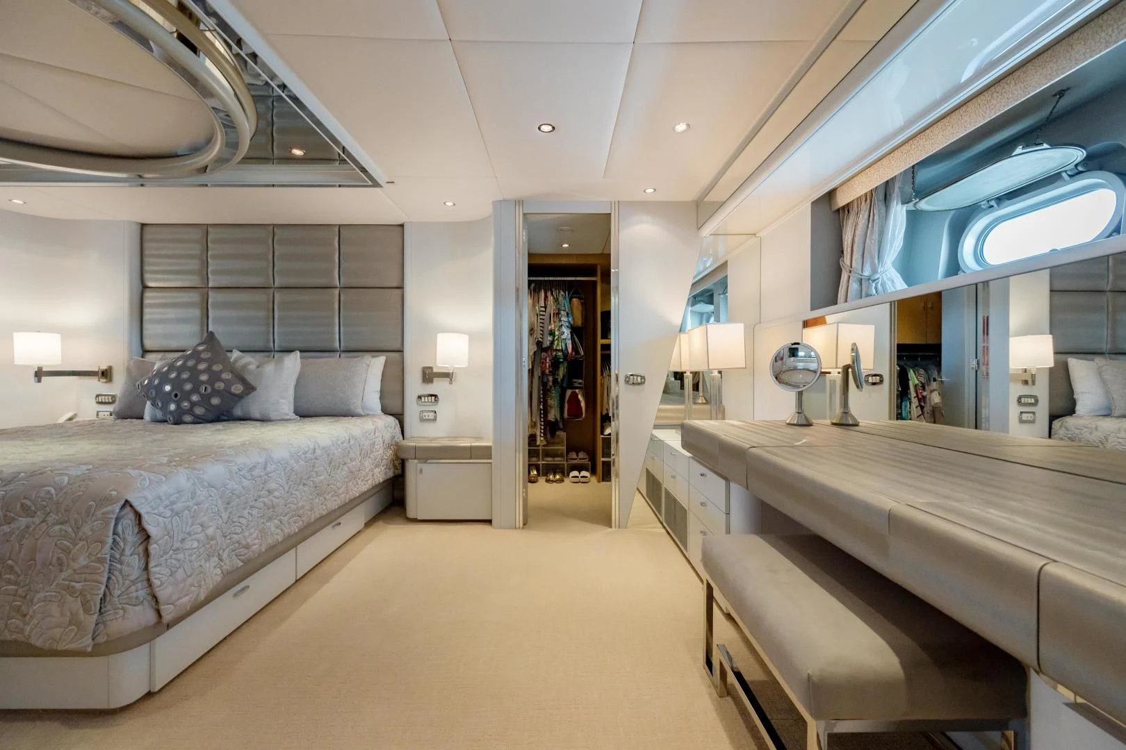a room with a bed and a desk aboard DREAM RIDER Yacht for Sale