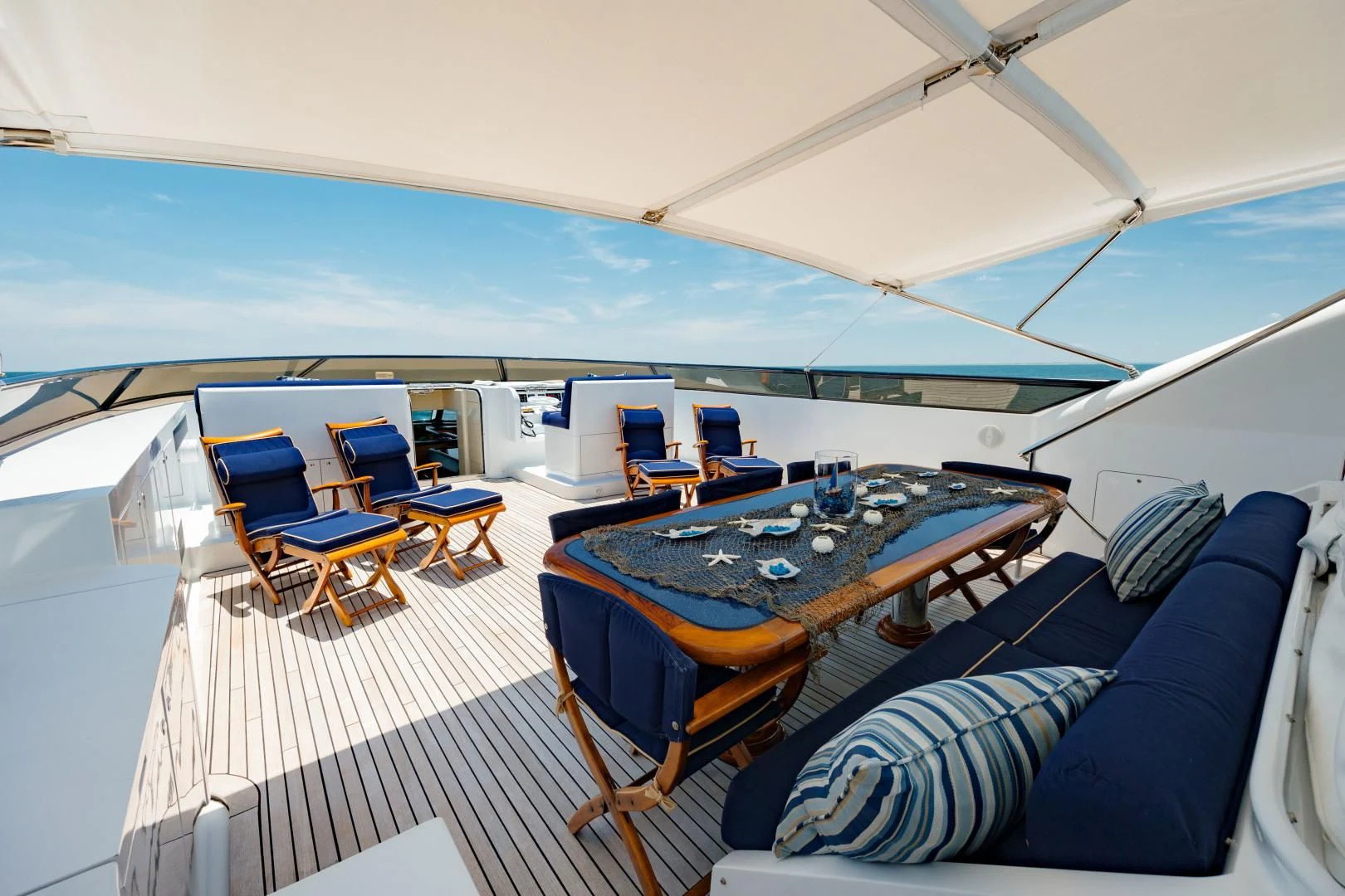 a tent with a table and chairs aboard DREAM RIDER Yacht for Sale