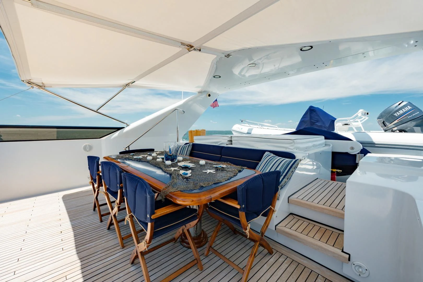 a tent with a table and chairs aboard DREAM RIDER Yacht for Sale