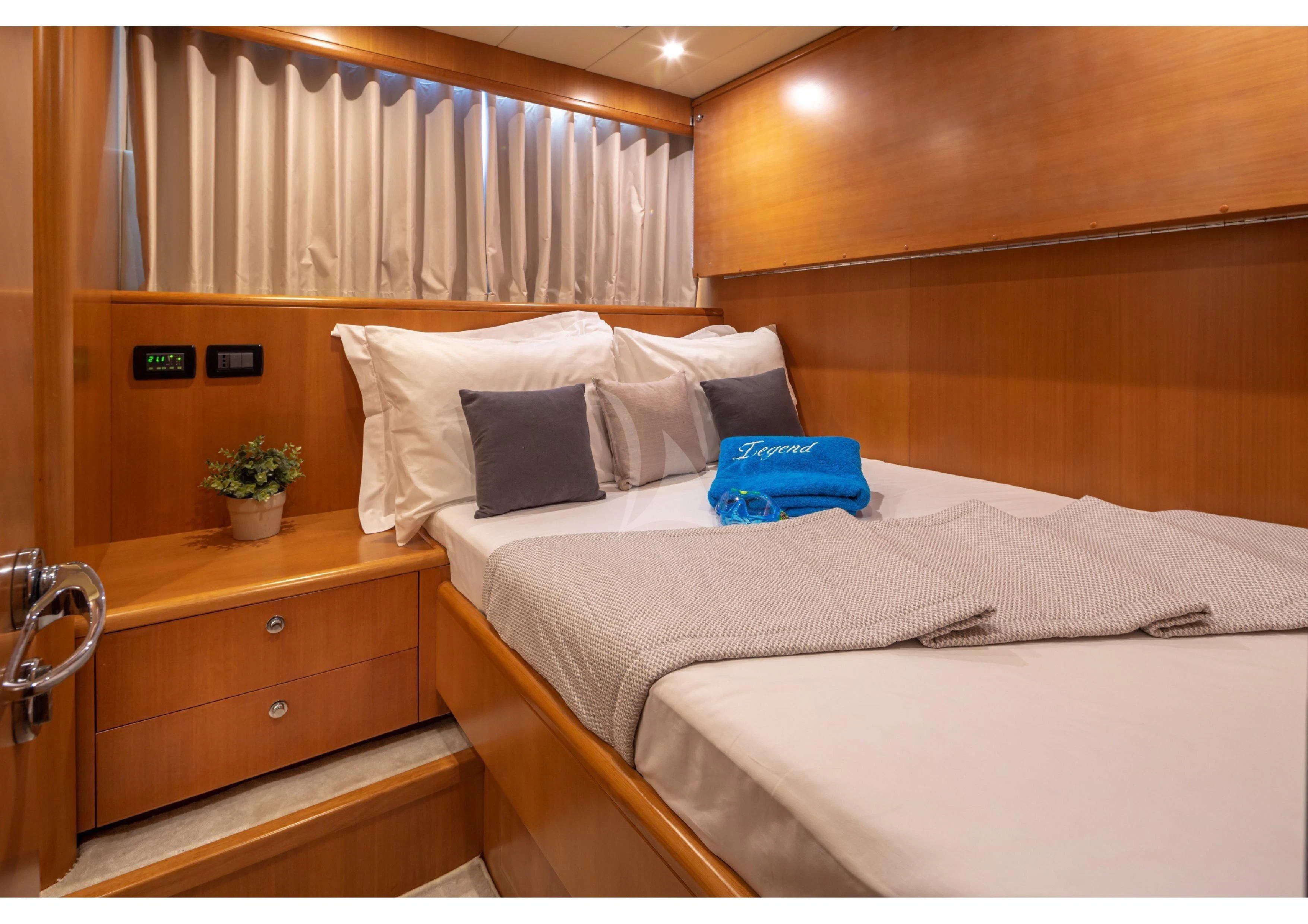a room with two beds aboard LEGEND Yacht for Sale