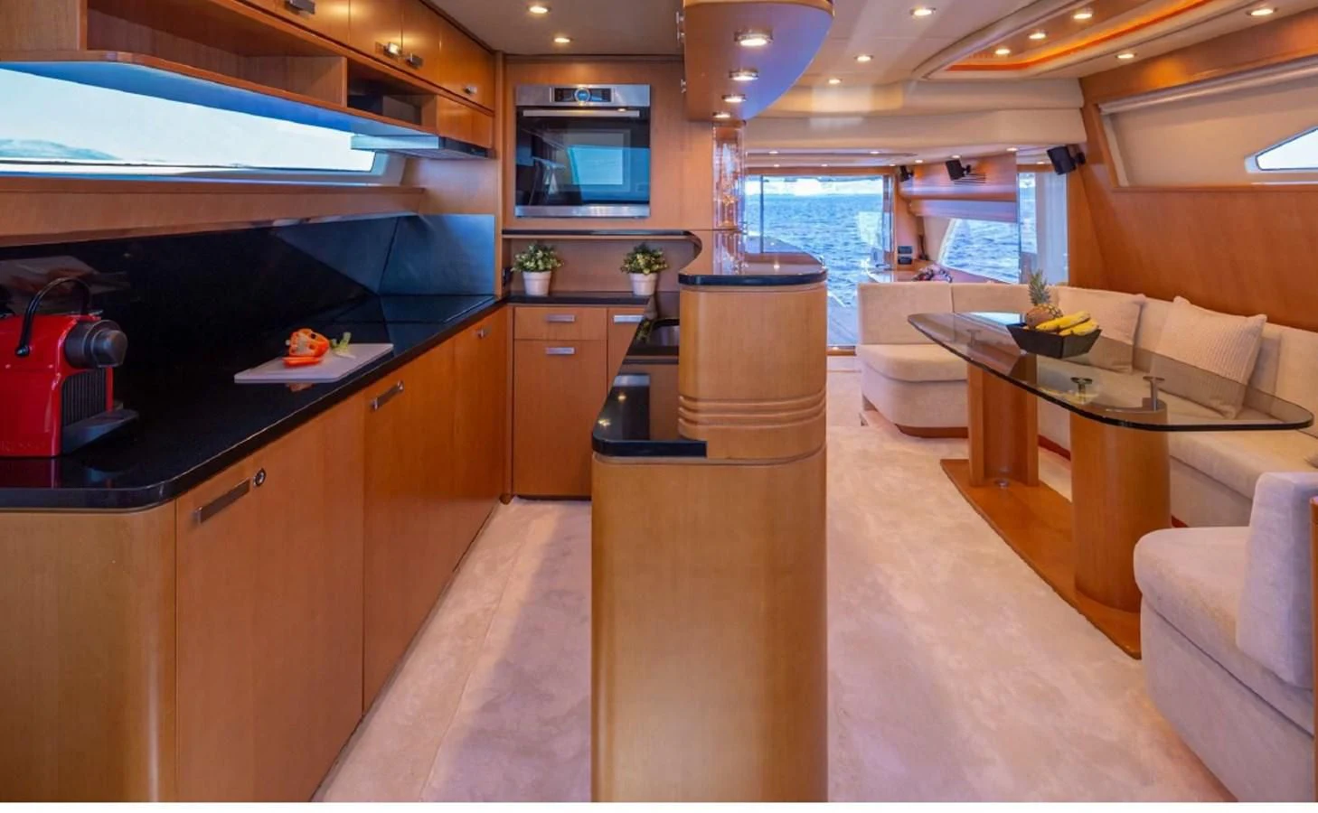 a kitchen with a large window aboard LEGEND Yacht for Sale