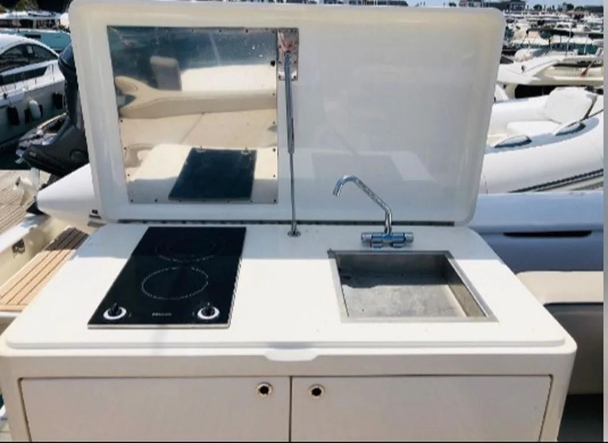 a computer on a desk aboard LEGEND Yacht for Sale