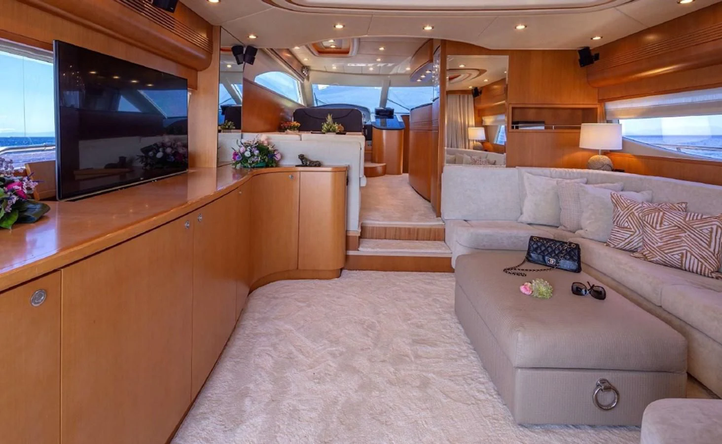 a living room with a couch and a tv aboard LEGEND Yacht for Sale