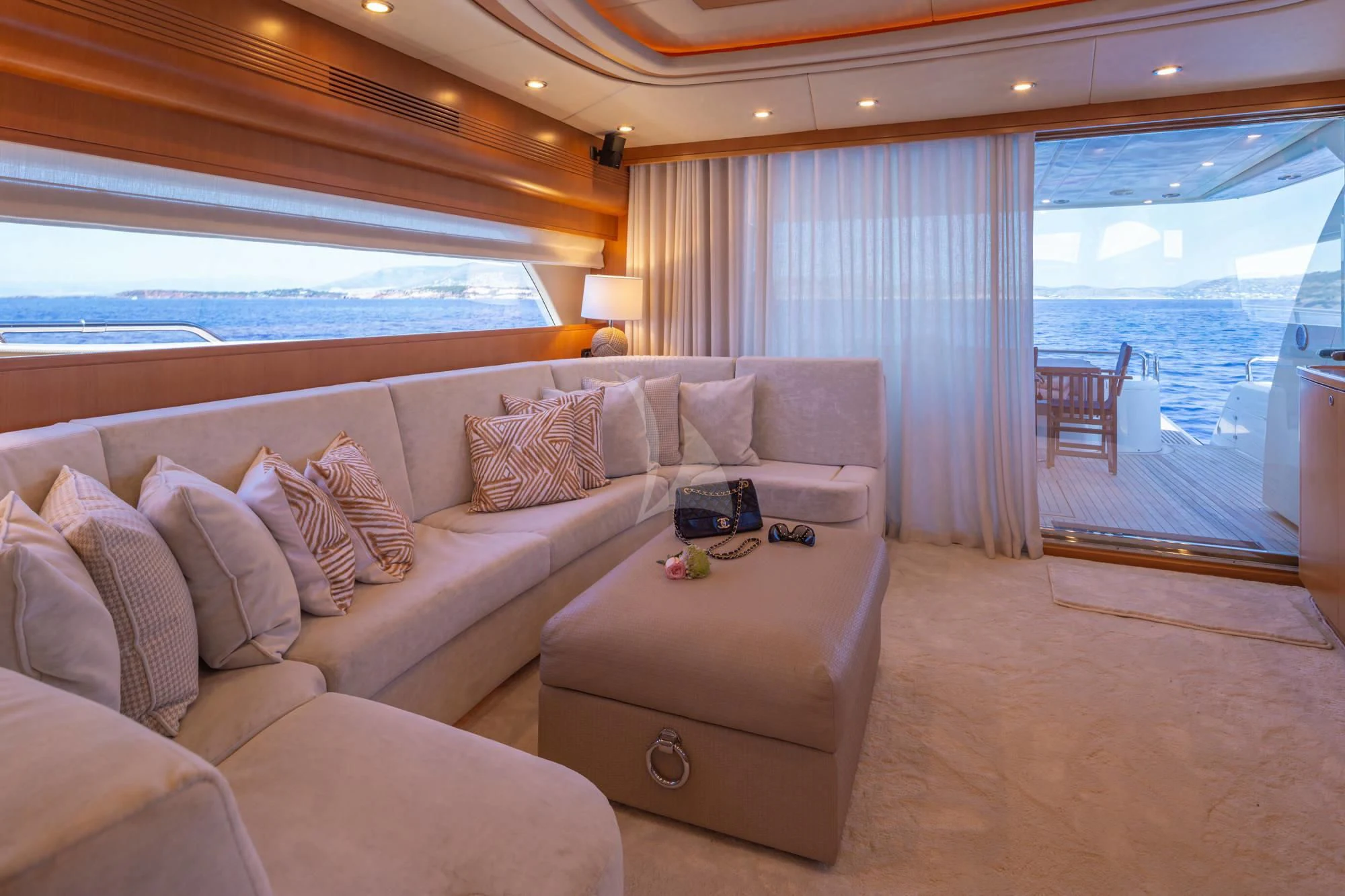a living room with a large window aboard LEGEND Yacht for Sale