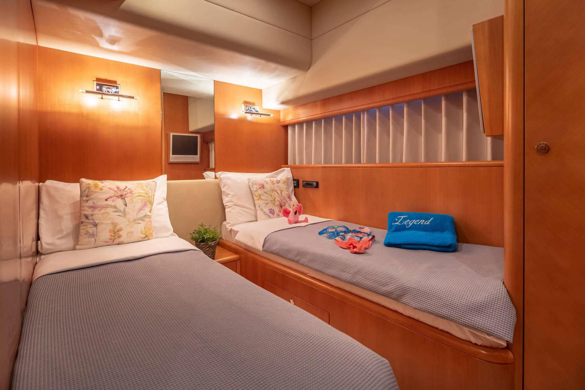 a couple of beds in a room aboard LEGEND Yacht for Sale