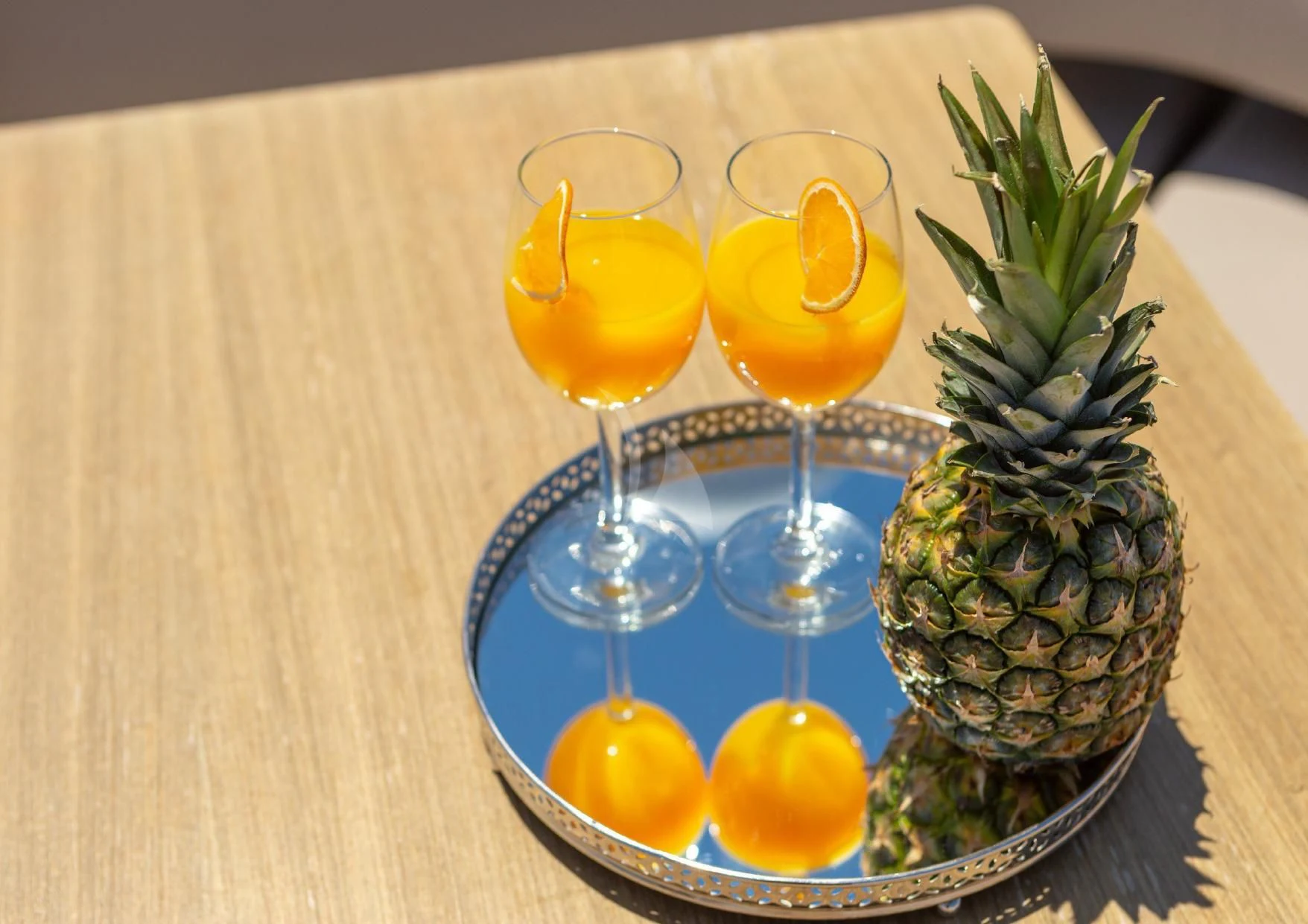 a group of glasses with drinks on a table aboard LEGEND Yacht for Sale