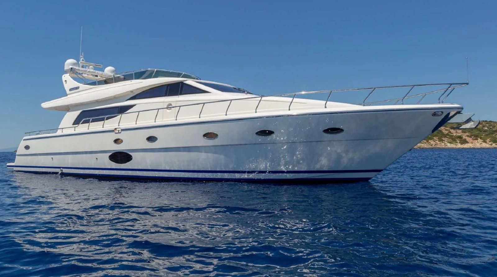 a white yacht on the water aboard LEGEND Yacht for Sale