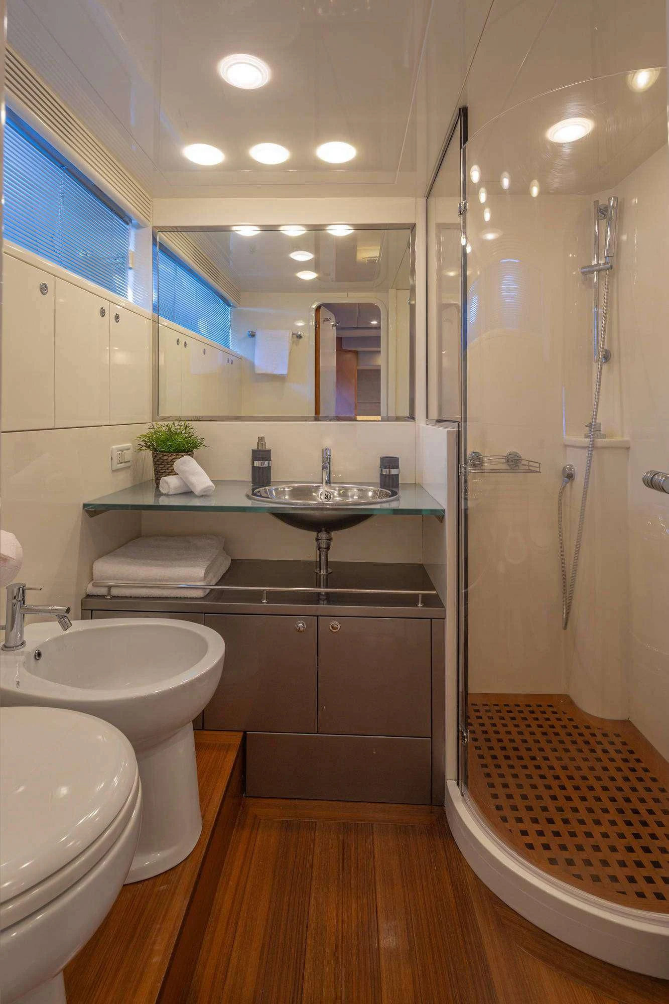 a bathroom with a sink and a mirror aboard LEGEND Yacht for Sale