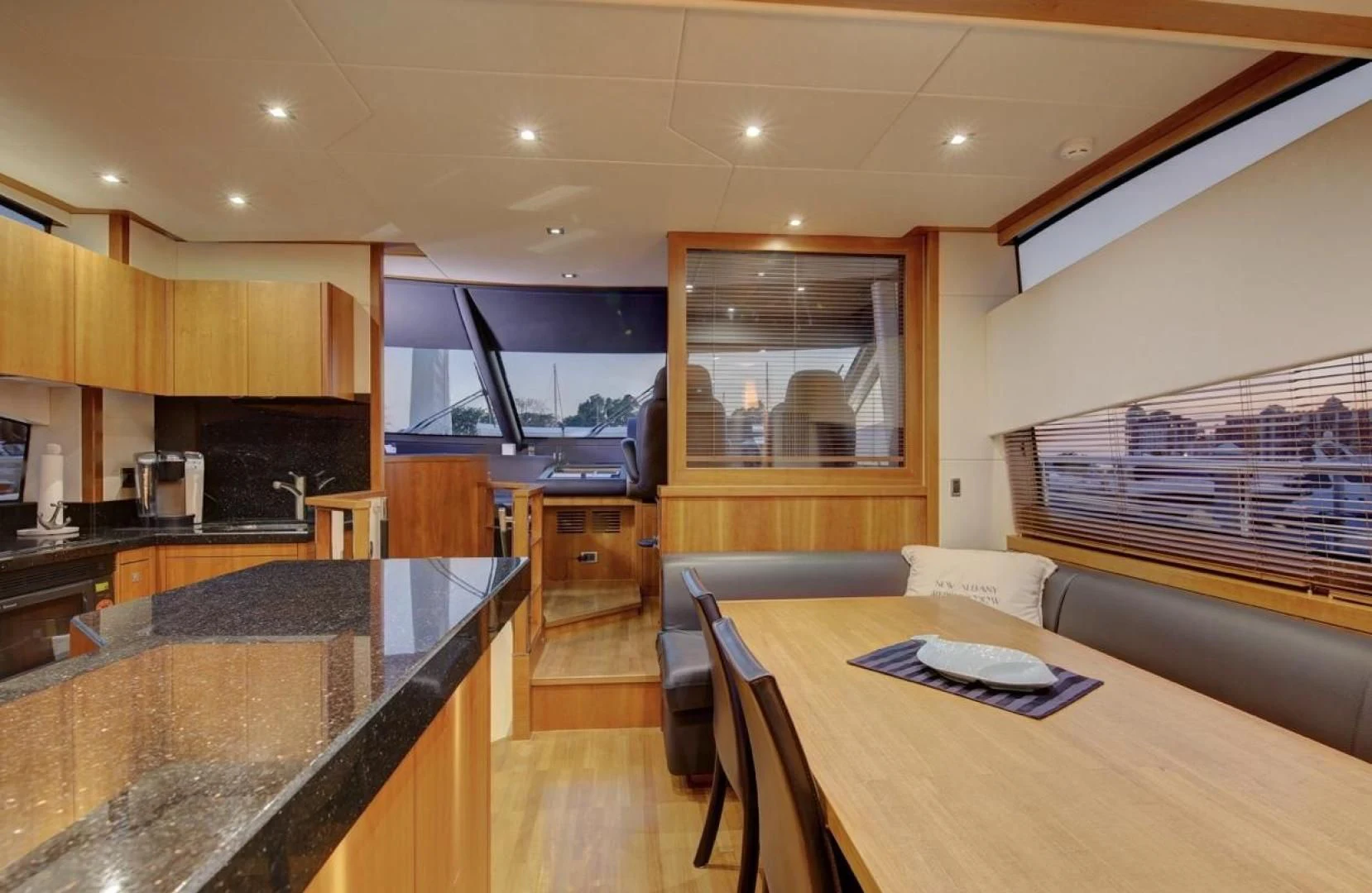 a kitchen with a table and chairs aboard SEA C Yacht for Sale