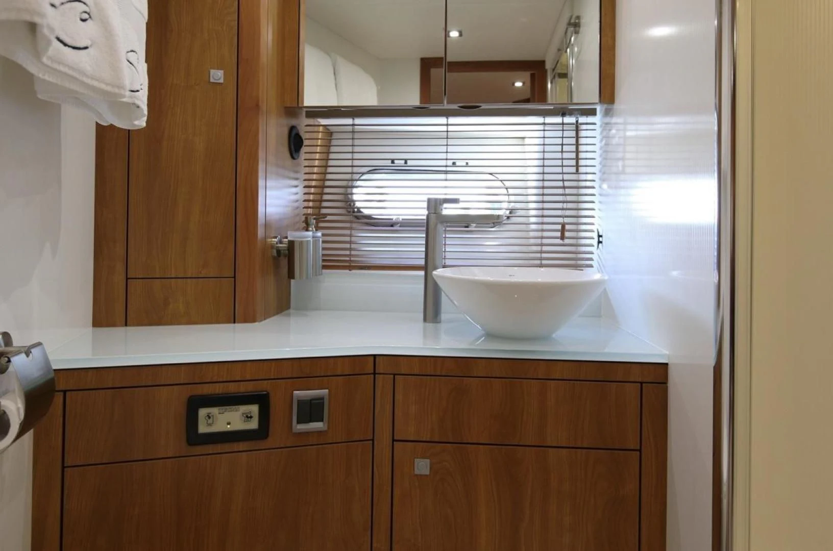 a bathroom with a sink and cabinets aboard SEA C Yacht for Sale