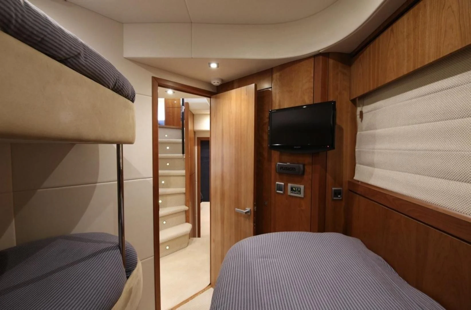 a room with a tv and a bed aboard SEA C Yacht for Sale