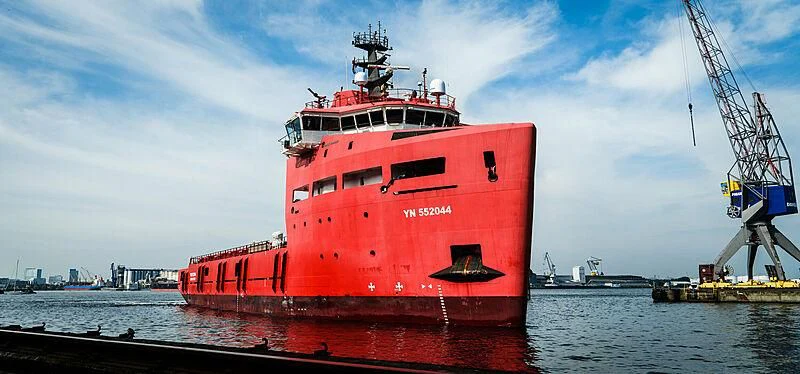 a large red ship in the water aboard DAWN Yacht for Sale