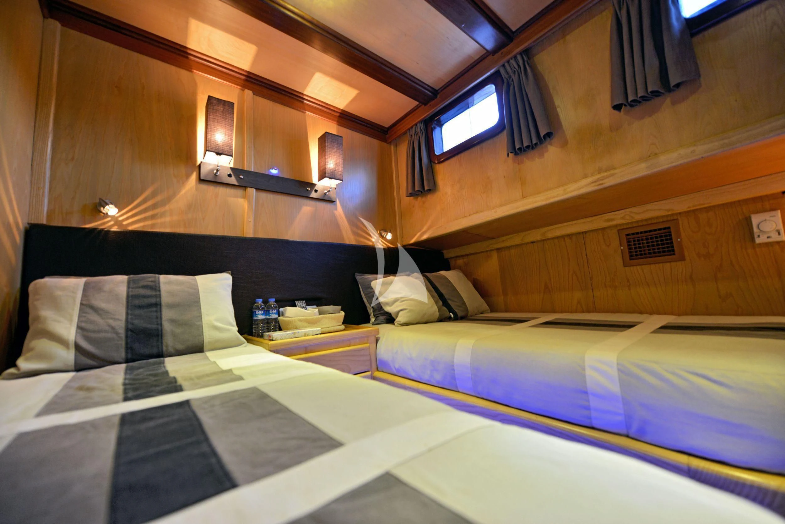 a room with two beds aboard DERIN DENIZ Yacht for Sale
