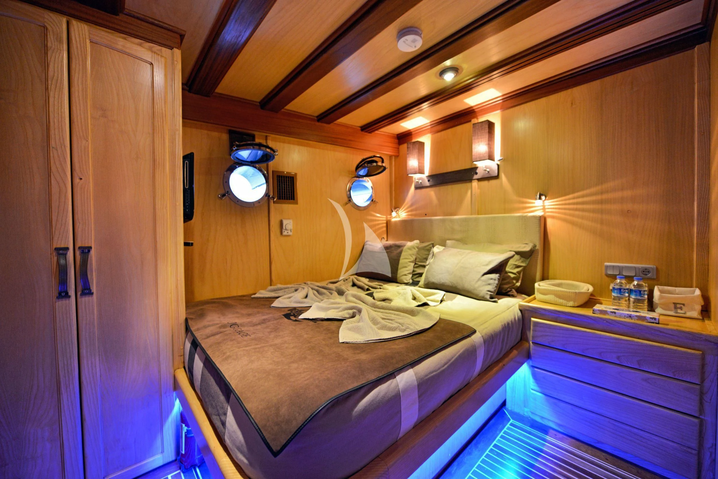 a room with a bed and a closet aboard DERIN DENIZ Yacht for Sale