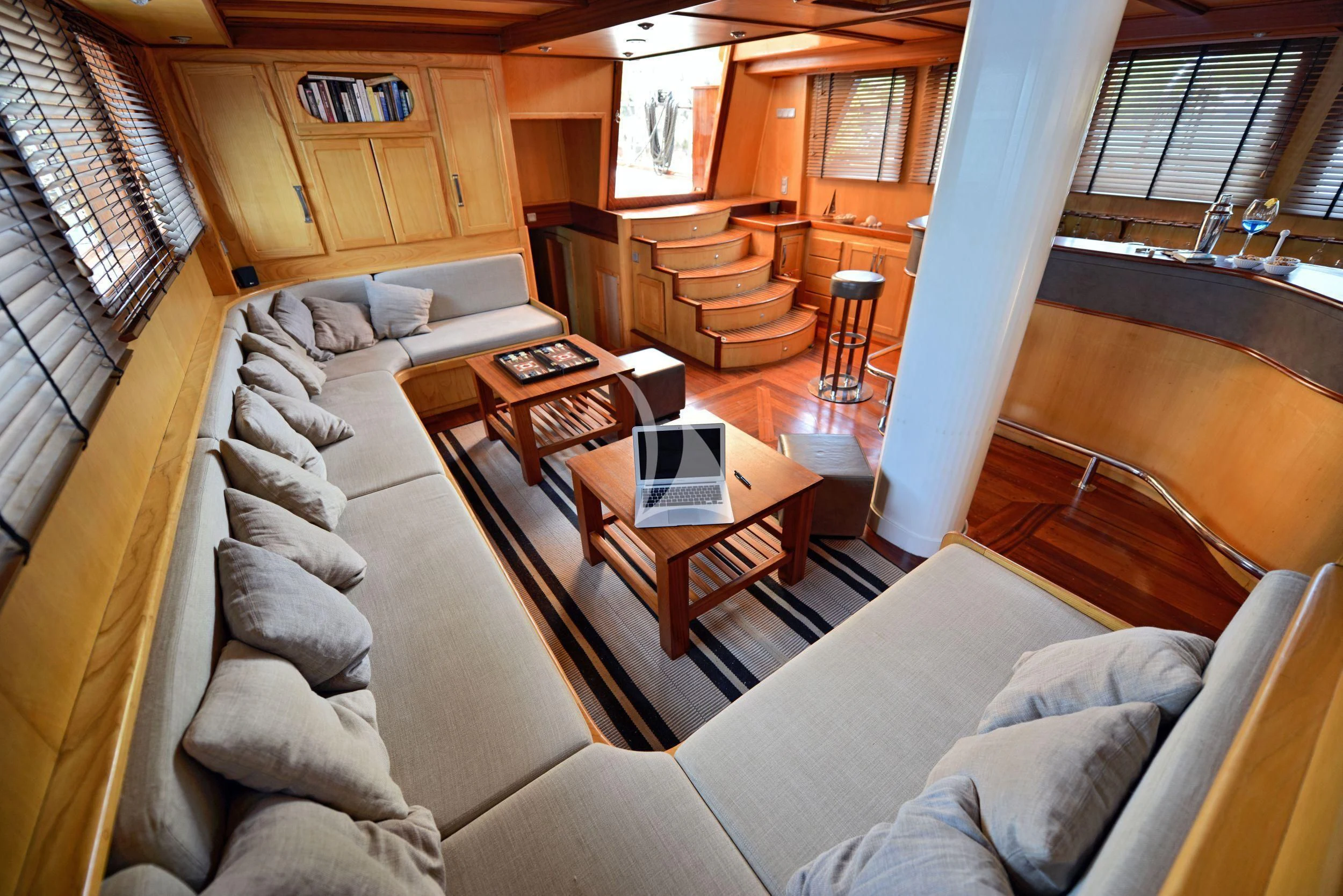a living room with a couch and a table aboard DERIN DENIZ Yacht for Sale