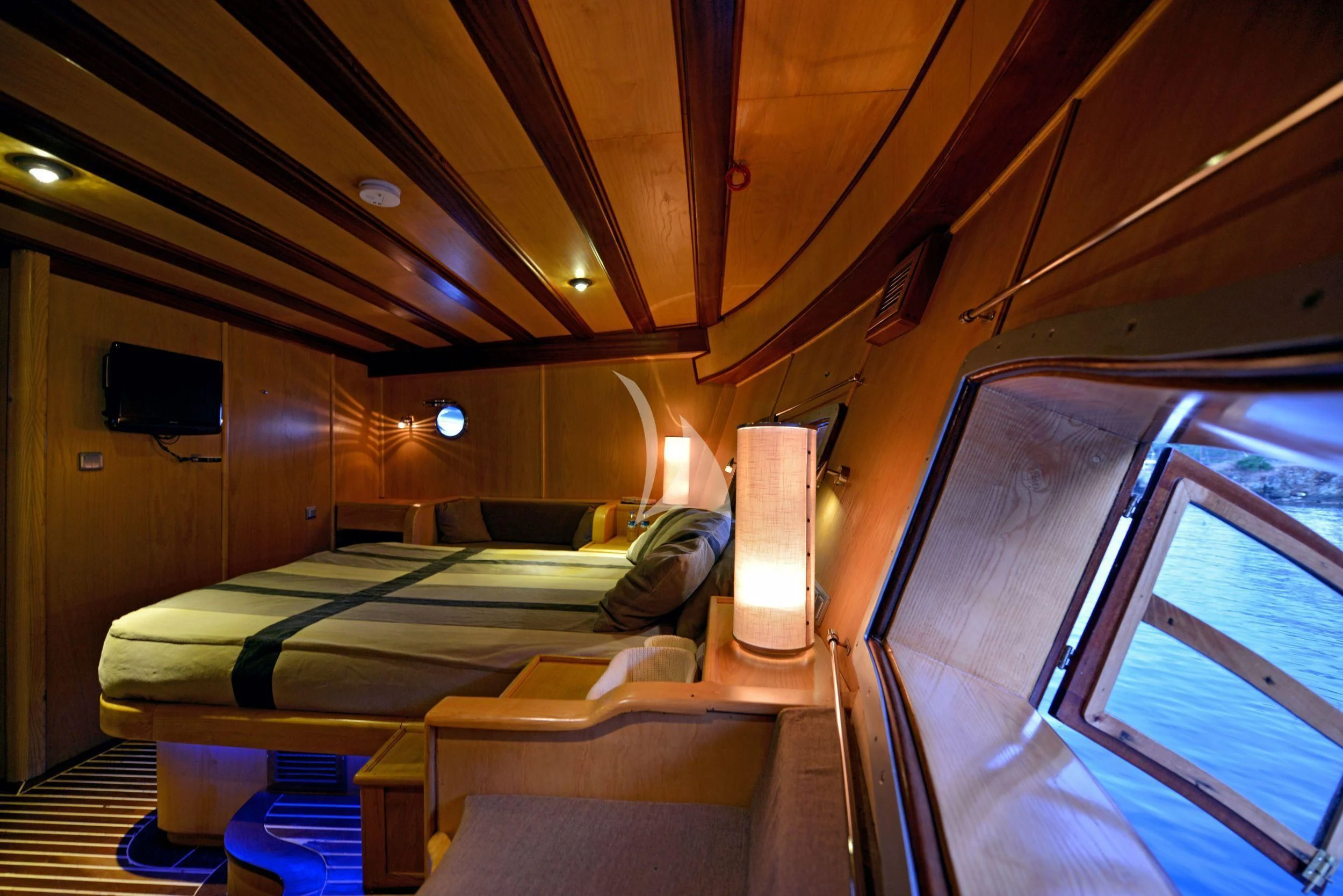 a room with a bed and a window aboard DERIN DENIZ Yacht for Sale