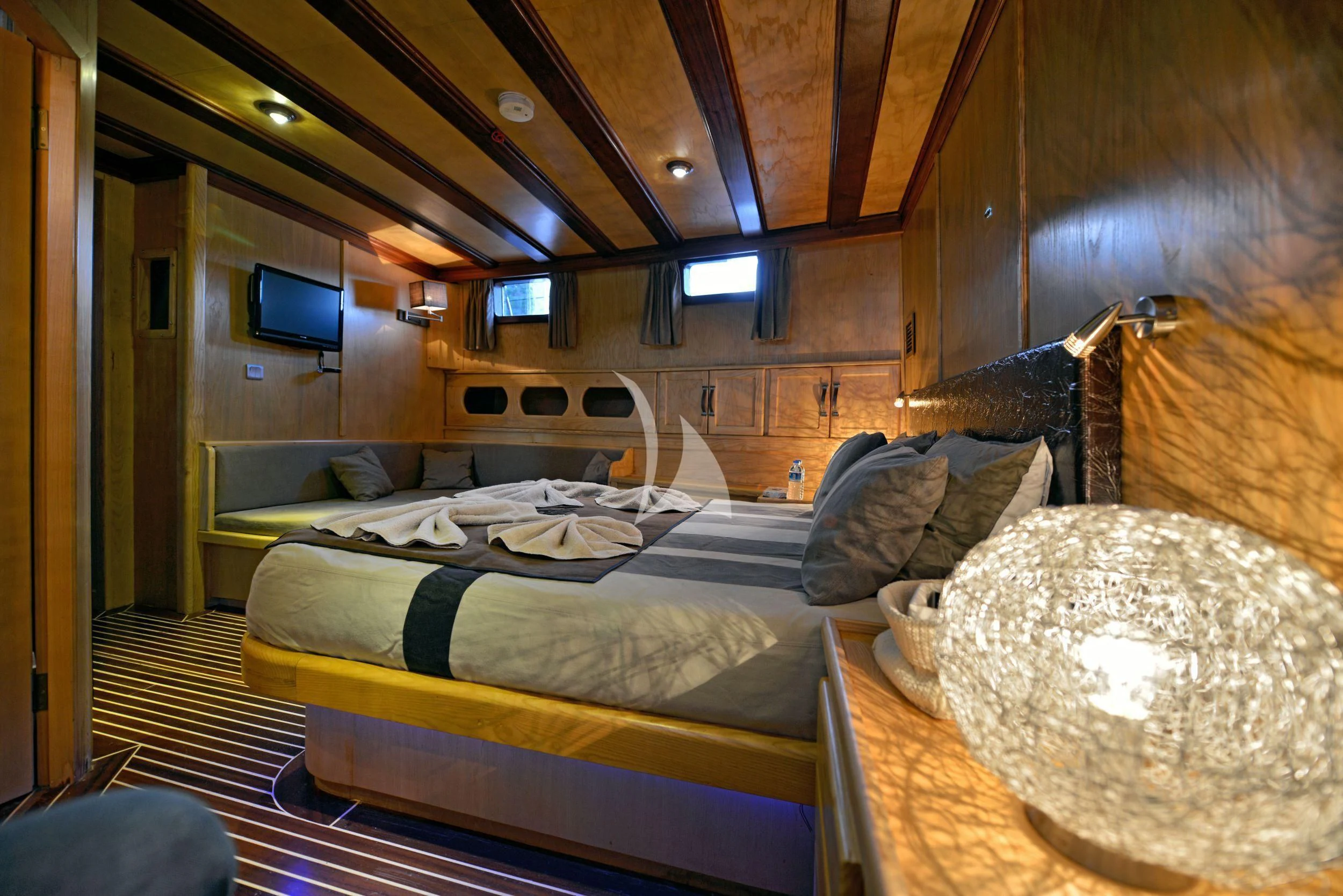 a room with a bed and a television aboard DERIN DENIZ Yacht for Sale