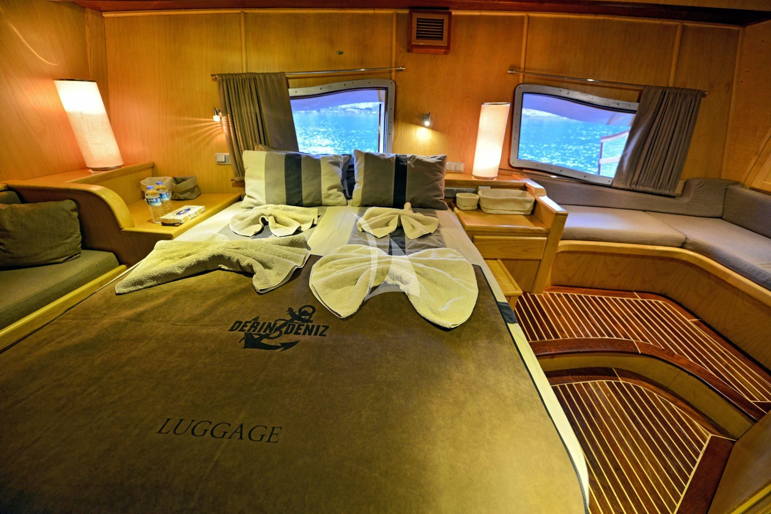 a hotel room with a bed and tv aboard DERIN DENIZ Yacht for Sale