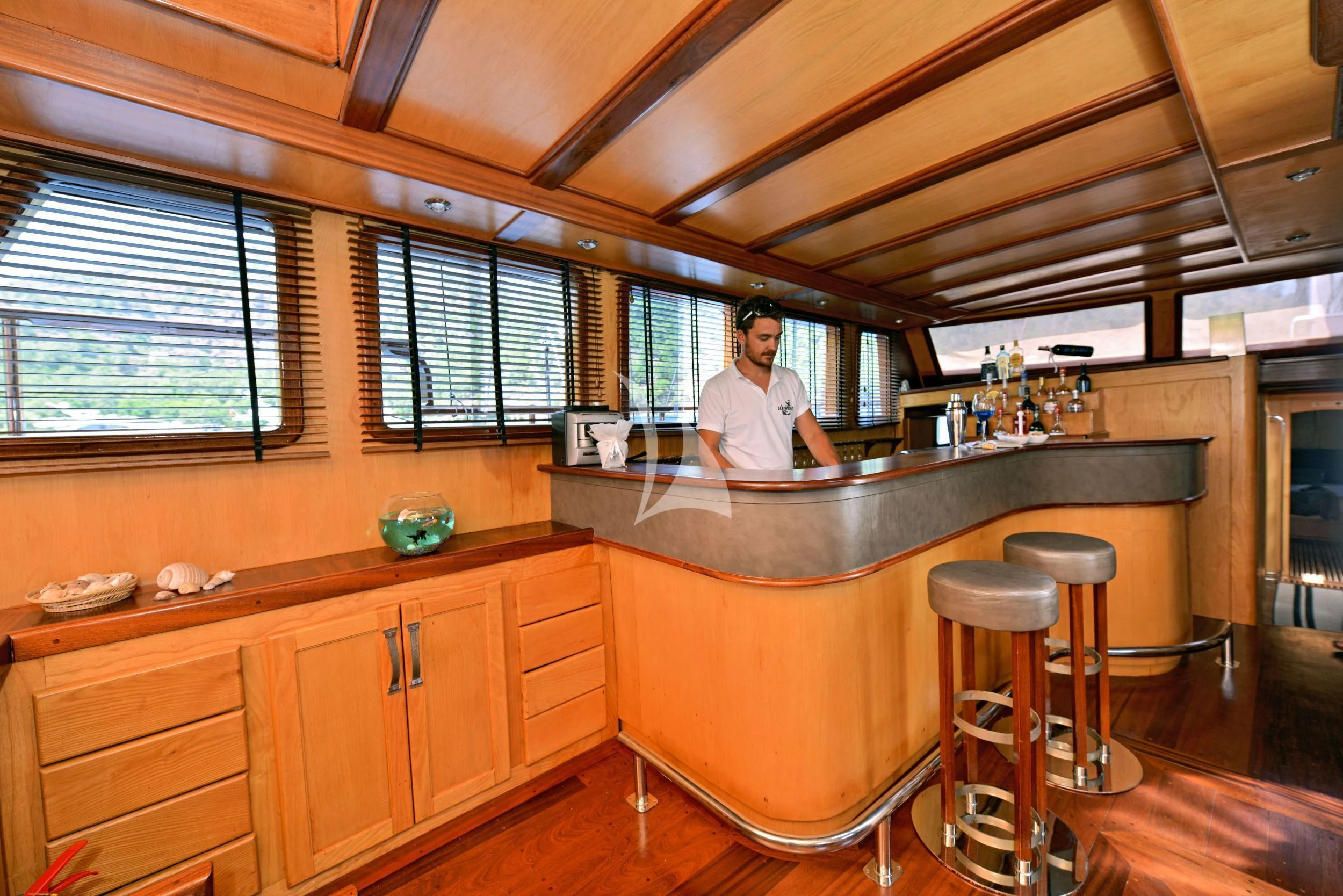 a person sitting at a bar aboard DERIN DENIZ Yacht for Sale