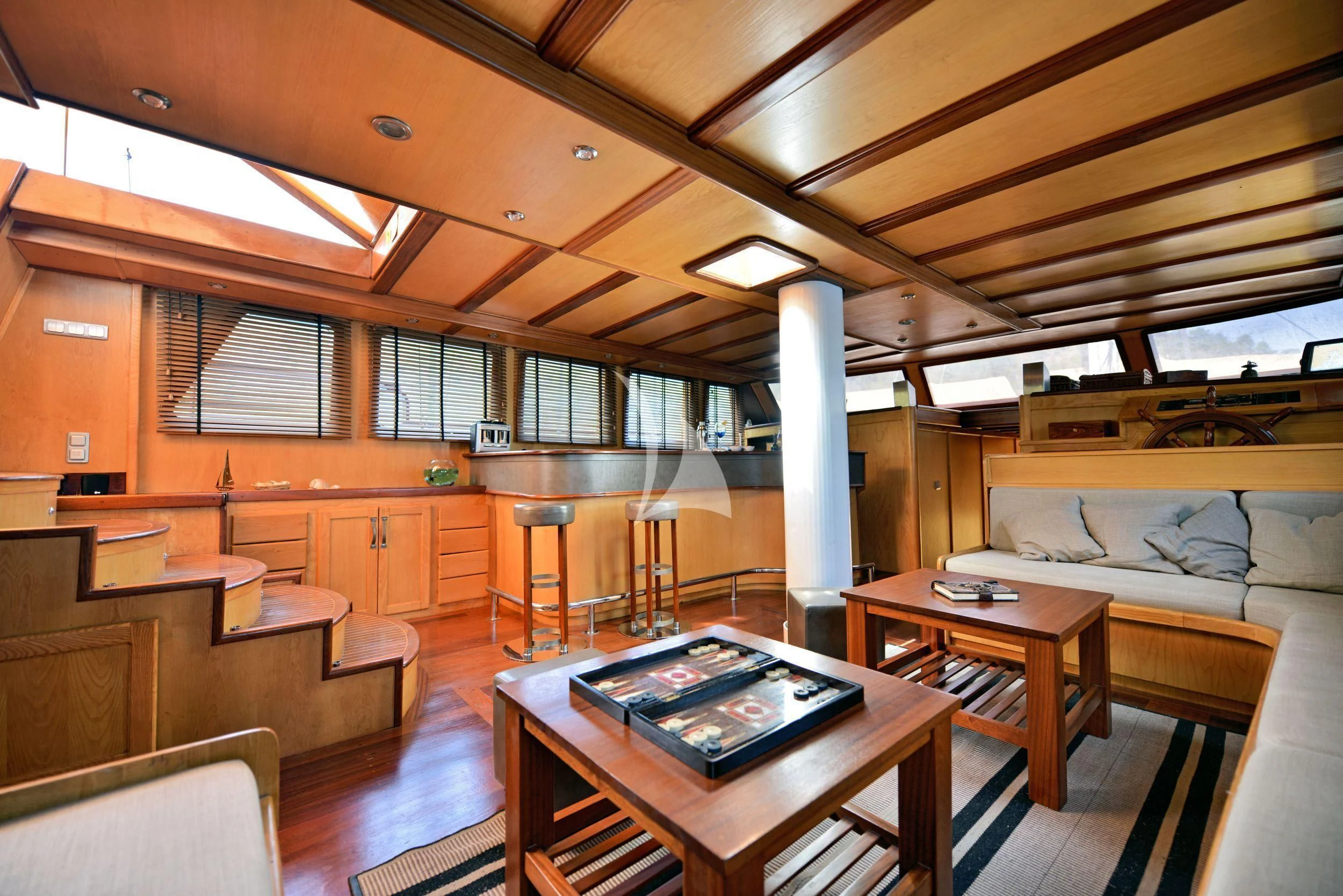 a room with a table and chairs aboard DERIN DENIZ Yacht for Sale