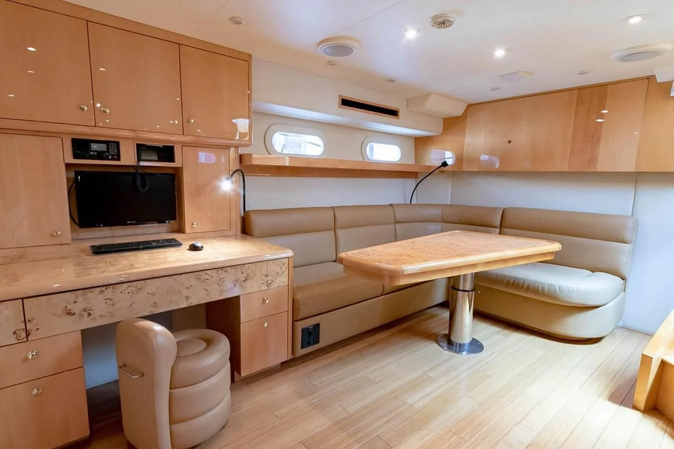 a room with a bed and a desk aboard PURELY PLEASURE Yacht for Sale