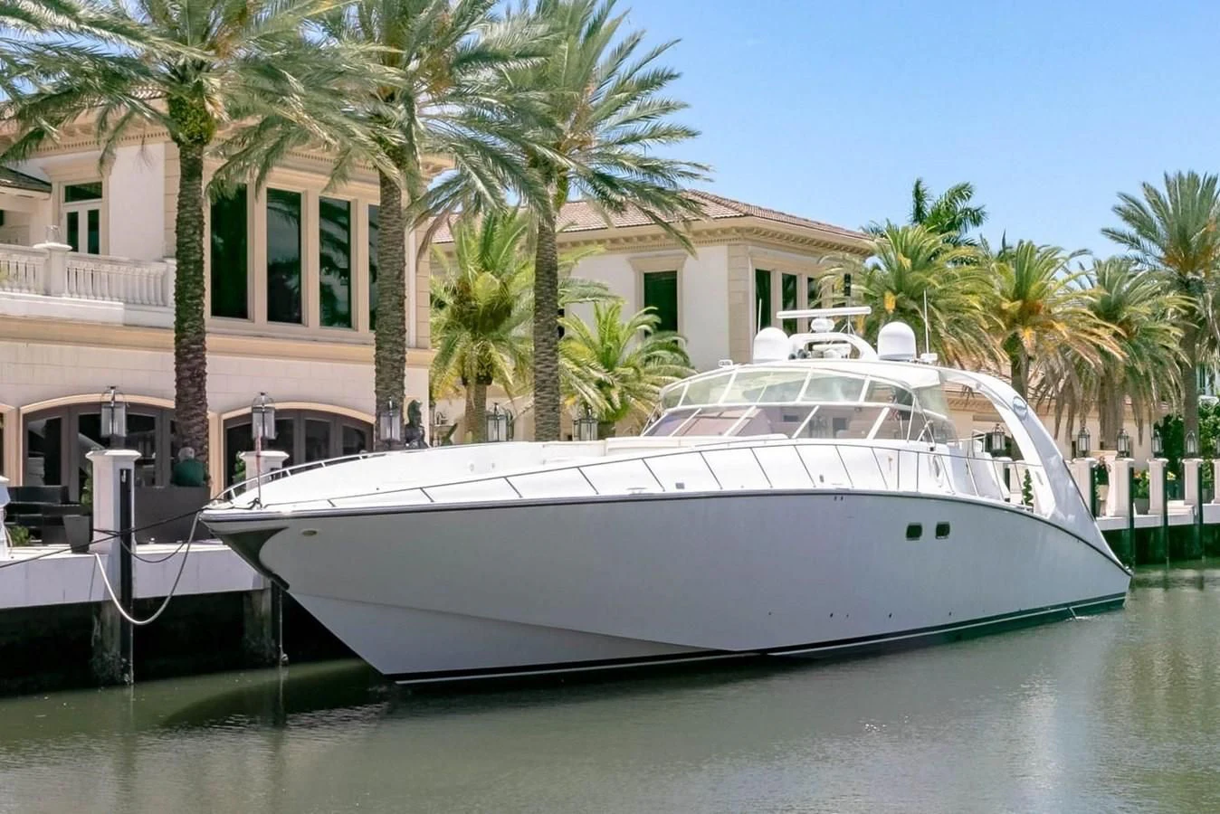 a white boat in a body of water aboard PURELY PLEASURE Yacht for Sale