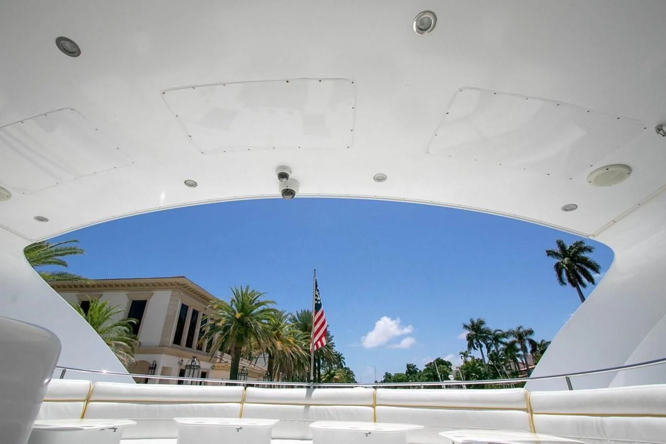 a white building with a flag on the roof aboard PURELY PLEASURE Yacht for Sale