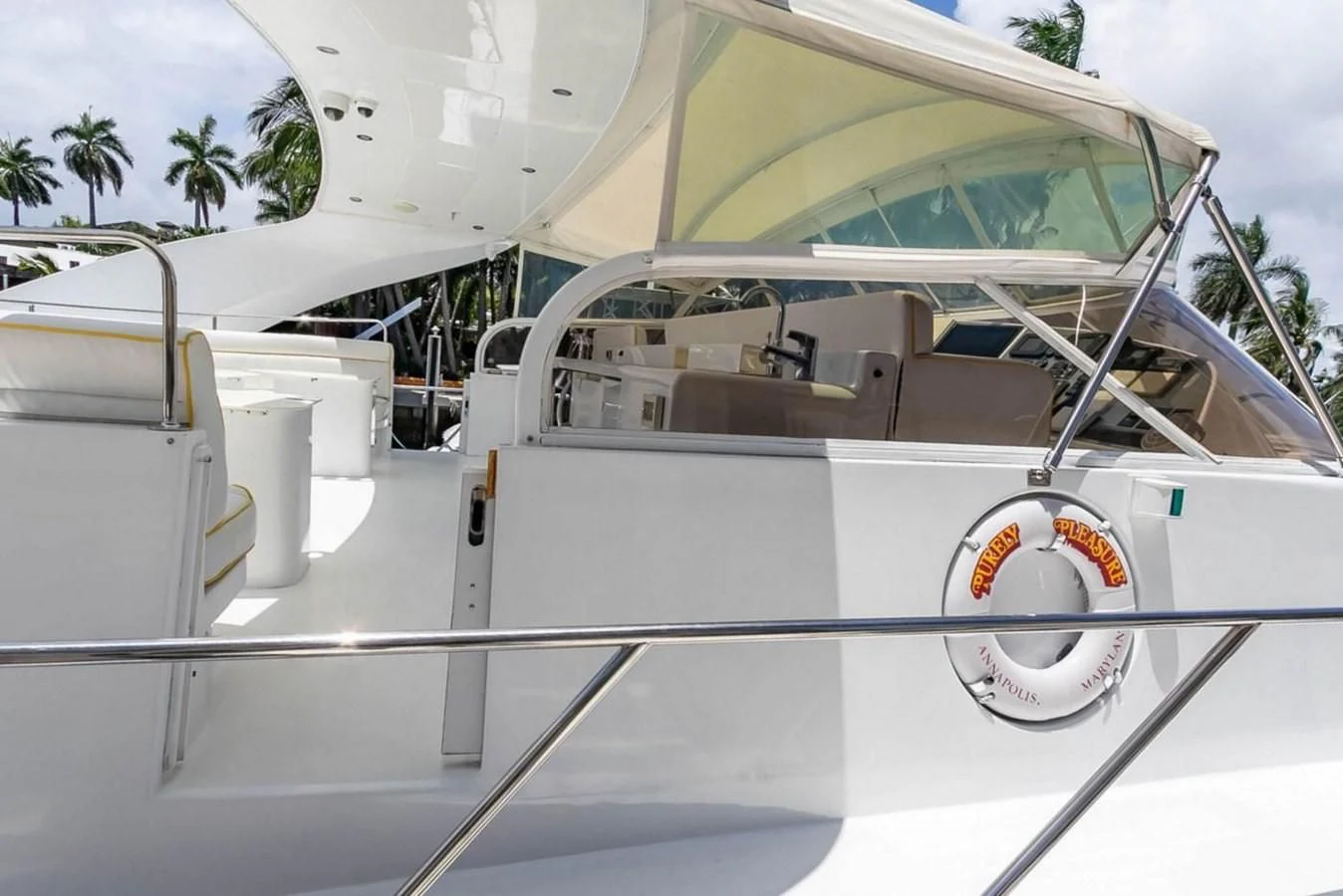 a white car with a logo on it aboard PURELY PLEASURE Yacht for Sale
