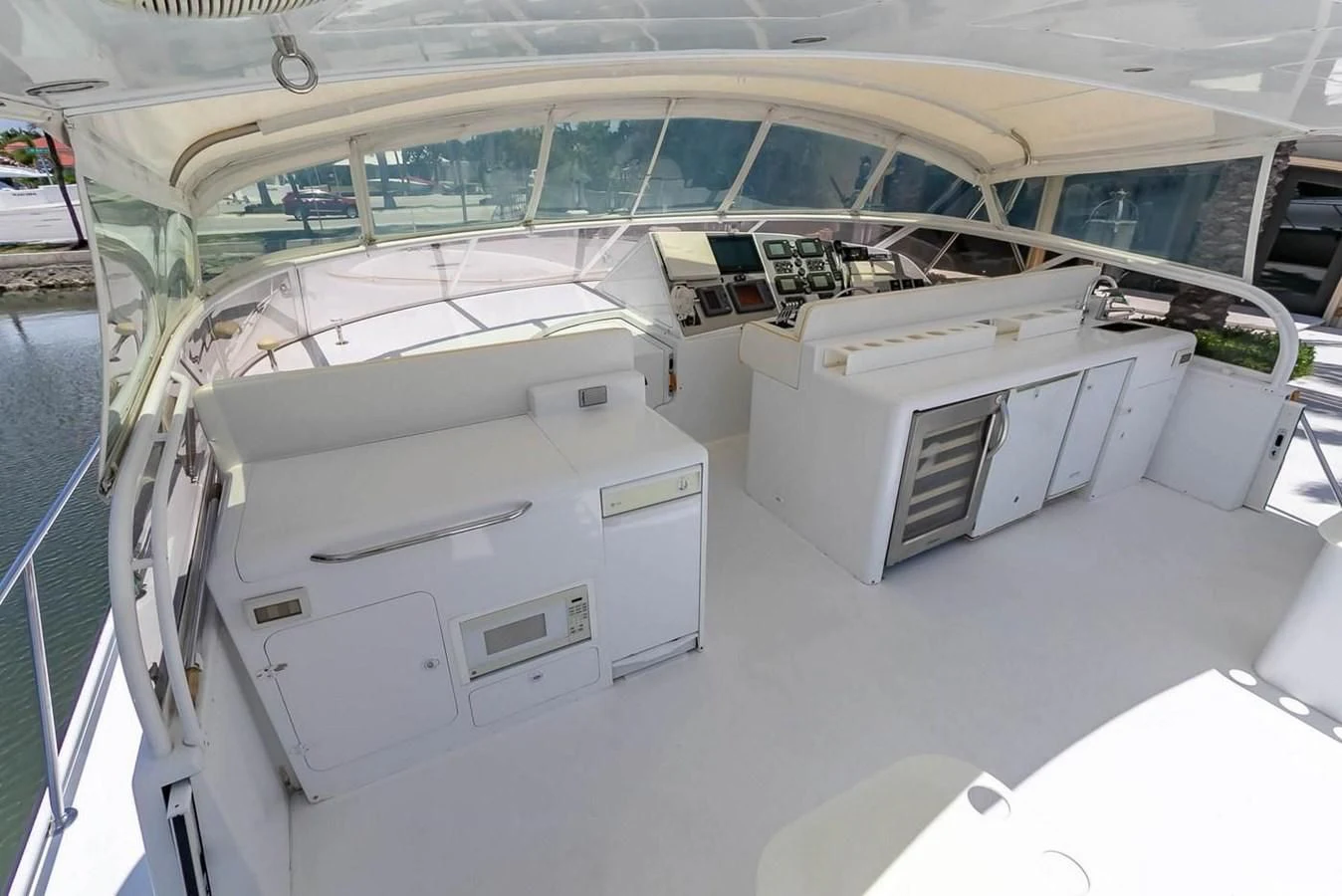 a large white room with a large window and a large white table aboard PURELY PLEASURE Yacht for Sale