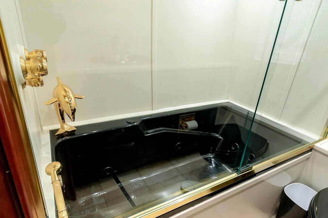 a toy figurine on a shelf in a bathroom aboard PURELY PLEASURE Yacht for Sale