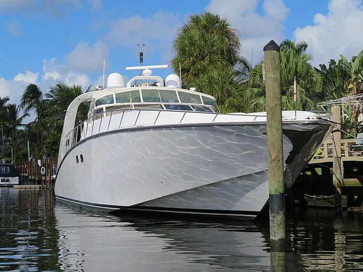 a white boat in the water aboard PURELY PLEASURE Yacht for Sale