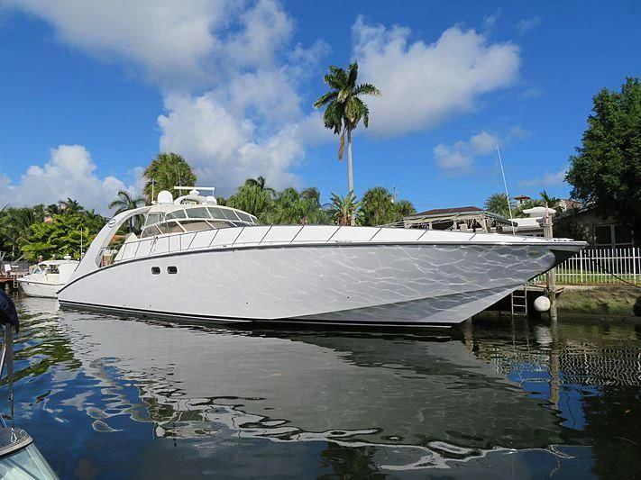 a boat docked at a pier aboard PURELY PLEASURE Yacht for Sale