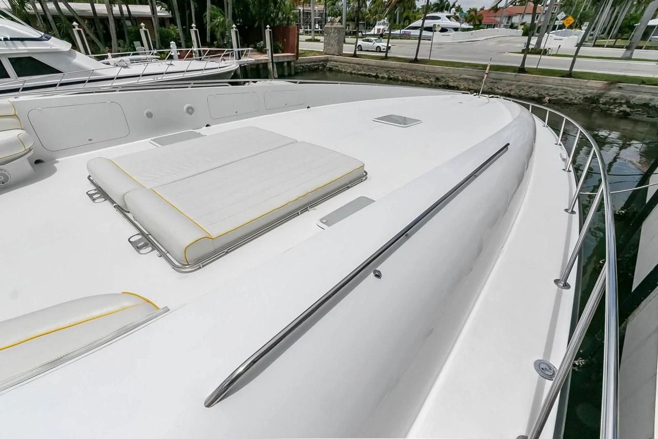 a white boat on a deck aboard PURELY PLEASURE Yacht for Sale
